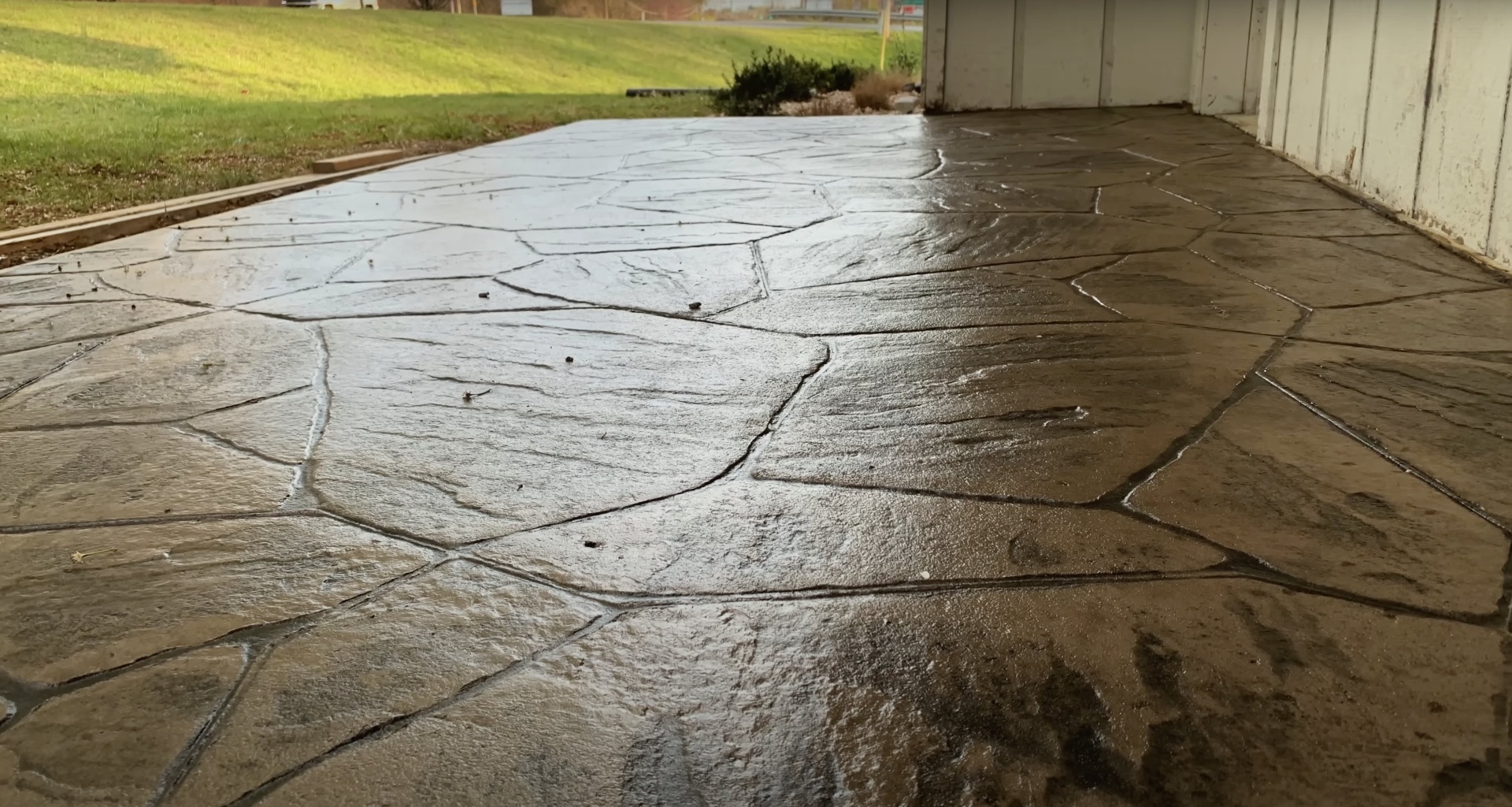 Concrete driveway damage assessment and repair evaluation Cracked concrete driveway showing wear and damage requiring professional repair or replacement