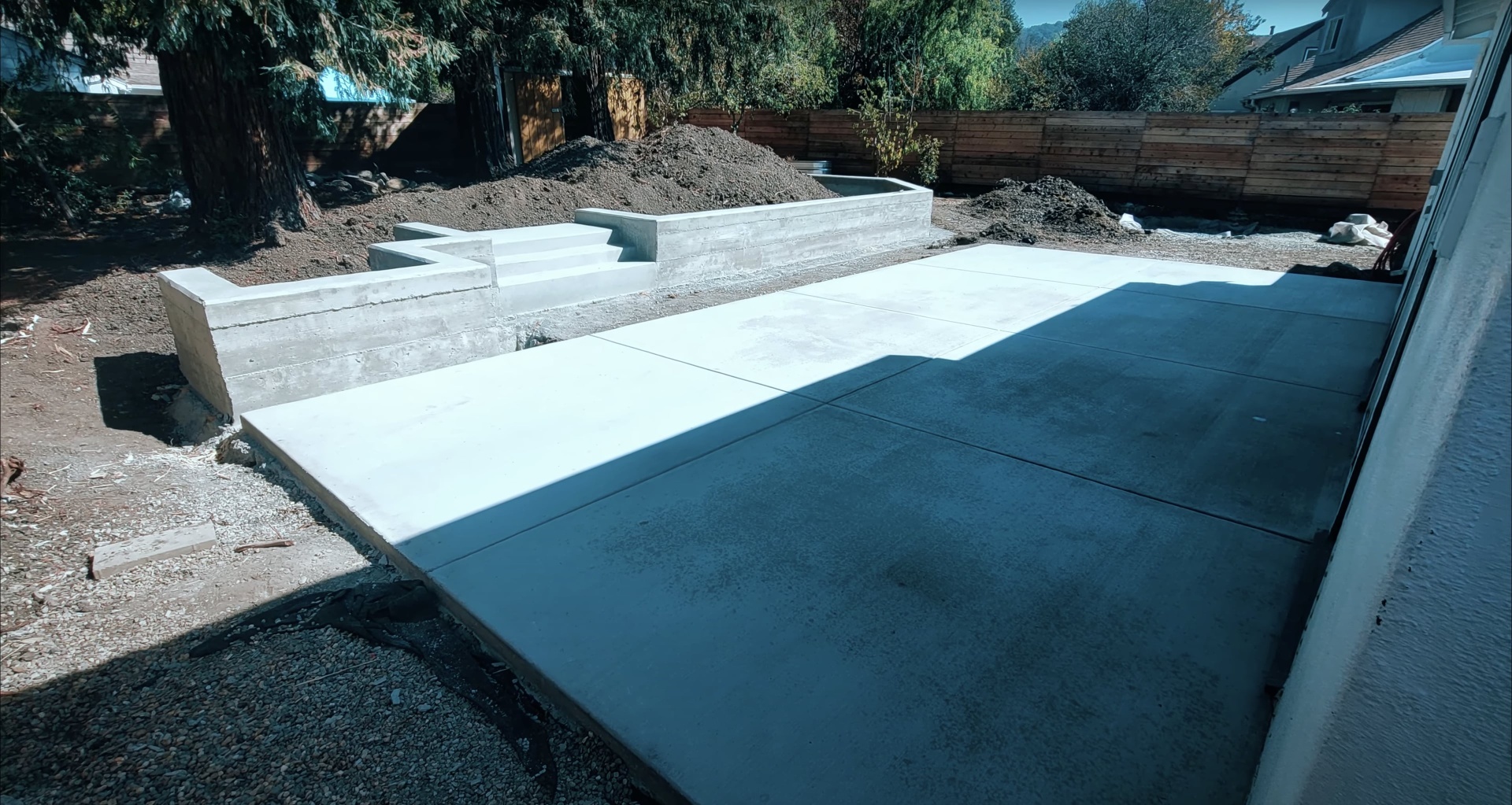 Modern concrete construction project showing finished concrete work in residential setting